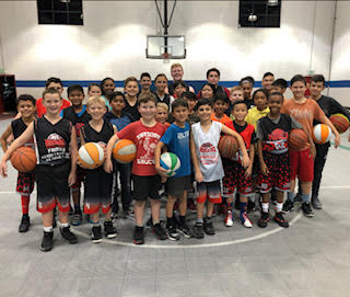 youth basketball team posing for a picture